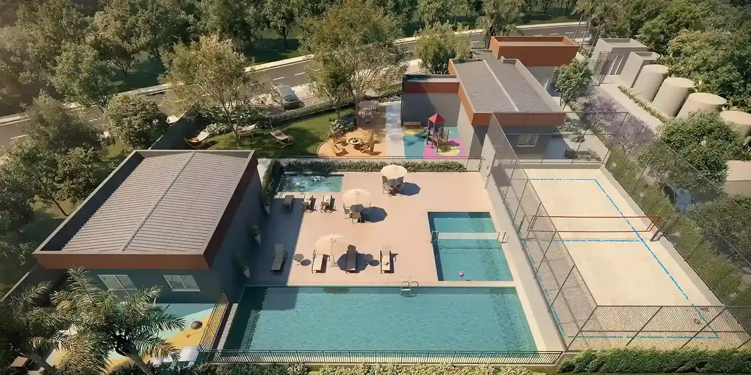 Vista aérea da área de lazer com piscina adulto, piscina infantil, biribol, solarium, quadra de beach sports e playground